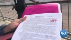 英语视频:寻求庇护者通过虚拟法庭受审 英语视频:寻求庇护者通过虚拟法庭受审