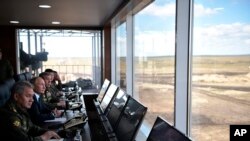 ရုရှားသမ္မတ ပူတင် - တရုတ်နဲ့စစ်ရေးလေ့ကျင့်မှုကို ကြည့်ရှုစဉ်။