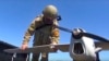 Знімок з відео пресслужби Міноборони Росії 8 серпня 2022 року російський військовослужбовець готує до запуску розвідувальний безпілотник "Орлан-10". Фото пресслужби Міноборони РФ/AP