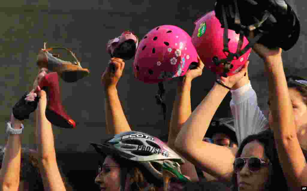 The high-heeled dress wearing cyclists commemorated International Women's Day after reaching the end of their bike route in Mexico City, March 7, 2015.