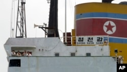 North Korean sailors stand on the deck of the North Korean-flagged cargo ship Chong Chon Gang in Sherman Bay near Colon City, Panama, February 12, 2014.