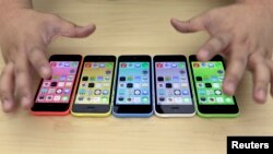 The new iPhone 5C in five colours are placed together at Apple Inc's announcement event in Beijing, September 11, 2013.
