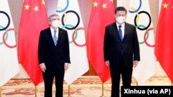 中共党媒新华社发布的中国领导人习近平在北京会见国际奥委会主席巴赫的照片。(2022年1月25日)
