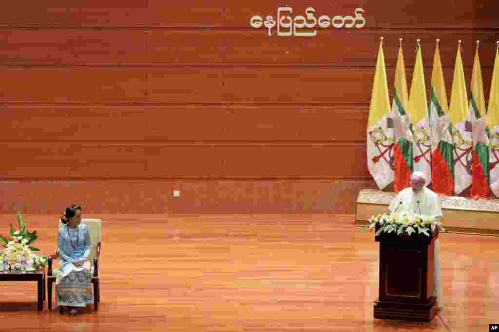 Myanmar's leader Aung San Suu Kyi, left, listens as Pope Francis delivers his speech at the International Convention Center of Naypyitaw, Nov. 28, 2017.