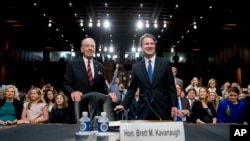 President Donald Trump's Supreme Court nominee, Brett Kavanaugh, a federal appeals court judge, right, accompanied by Senate Judiciary Chairman Chuck Grassley, R-Iowa, left, on Capitol Hill
