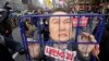 Protesters carry a caricature depicting an imprisoned South Korean President Yoon Suk Yeol as they march to the presidential office after a rally demanding his impeachment in Seoul, South Korea, Dec. 12, 2024. 