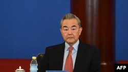 资料照片:2024年12月17日,中国外交部长王毅在北京钓鱼台国宾馆出席“2024年国际形势与中国外交关系”研讨会开幕式。