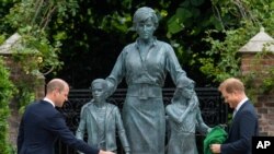 Britain's Prince William, left, and Prince Harry during the unveiling of a statue they commissioned of their mother Diana, Princess of Wales, in the Sunken Garden at Kensington Palace, London, on what would have been her 60th birthday, July 1, 2021.