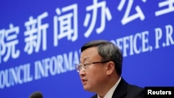 中国商务部副部长王受文在北京召开的记者会上宣布美中已就第一阶段贸易协议文本达成一致。(2019年12月13日)