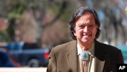 Former New Mexico Gov. Bill Richardson emerges from his office in Santa Fe, N.M., Thursday, March 9, 2020.