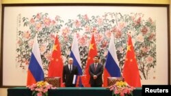 俄罗斯总统普京和中国主席习近平在北京钓鱼台国宾馆的签字仪式上(2014年11月9日)