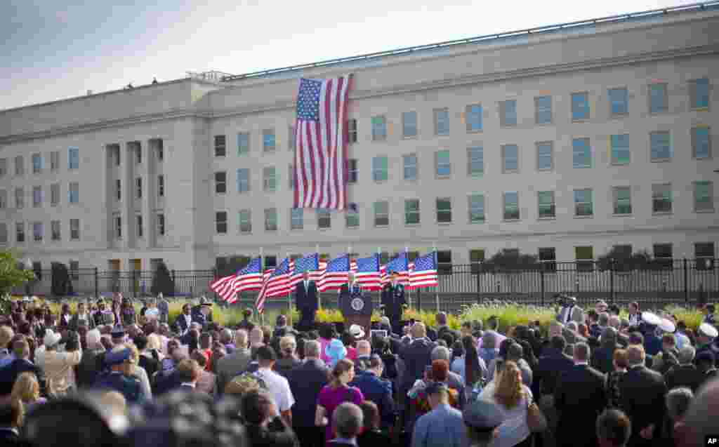 From left, President Barack Obama, Defense Secretary Chuck Hagel and Joint Chiefs Chairman Gen. Martin Dempsey participate in a ceremony at the Pentagon, Sept. 11, 2014, to mark the 13th anniversary of the 9/11 attacks.