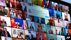 2021年4月23日,当拜登总统从白宫为虚拟世界领导人峰会致辞时,屏幕上显示出各国领导人。(美联社照片)